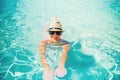 portrait of attractive woman sunbathing and smiling at camera. Summer beach holiday, pool details Royalty Free Stock Photo