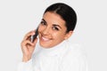 Beautiful portrait of attractive young happy woman with mobile phone with pretty toothy smile, on the white background Royalty Free Stock Photo