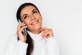 Beautiful portrait of attractive young happy woman with mobile phone with pretty toothy smile, on the white background. Royalty Free Stock Photo