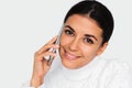 Beautiful portrait of attractive young happy woman with mobile phone with pretty toothy smile, on the white background. Royalty Free Stock Photo