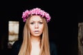 Beautiful portrait of a blonde girl with a pink crown of flowers Royalty Free Stock Photo