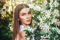 beautiful portrait in blooming apple tree