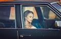 Bride sitting in car Royalty Free Stock Photo