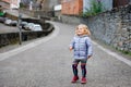 Beautiful portrait of cute little toddler girl. Happy baby child looking at the camera and smiling. Kid making a walk Royalty Free Stock Photo