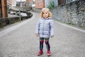 Beautiful portrait of cute little toddler girl. Happy baby child looking at the camera and smiling. Kid making a walk Royalty Free Stock Photo