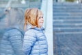 Beautiful portrait of cute little toddler girl. Happy baby child looking at the camera and smiling. With reflections of Royalty Free Stock Photo