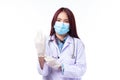 Beautiful portrait friendly asian female doctor or nurse in medical mask and glove at medical clinic isolated on white background Royalty Free Stock Photo