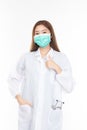 Beautiful portrait friendly asian female doctor or nurse in medical mask showing thumbs up at medical clinic isolated on white Royalty Free Stock Photo