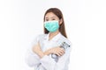 Beautiful portrait friendly asian female doctor or nurse in medical mask showing thumbs up at medical clinic isolated on white Royalty Free Stock Photo