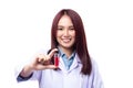 Beautiful portrait friendly asian female doctor or nurse showing medicine vial and smile isolated on white background. Healthcare Royalty Free Stock Photo