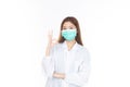 Beautiful portrait friendly asian female doctor or nurse wear medical mask at medical clinic isolated on white background. Mask to Royalty Free Stock Photo