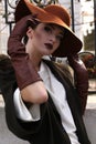 Beautiful portrait of ladylike woman in elegant coat and hat