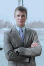 Portrait of happy businessman standing in office