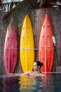 Beautiful portrait mixed race young woman in a swimming pool. Royalty Free Stock Photo