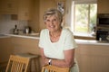 Beautiful portrait of pretty and sweet senior mature woman in middle age around 70 years old smiling happy and friendly at home Royalty Free Stock Photo