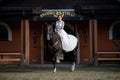 Beautiful portrait of woman bride with horse