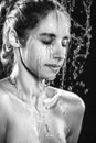 Beautiful portrait of woman with fresh skin in water splashes. Royalty Free Stock Photo