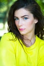 Beautiful portrait of woman with long hairs in yellow bright t-shirt Royalty Free Stock Photo