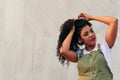 Beautiful portrait of woman styling her beautiful curly hair Royalty Free Stock Photo