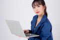 Beautiful portrait young asian business woman holding laptop computer isolated on white background Royalty Free Stock Photo