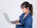 Beautiful portrait young asian business woman holding laptop computer isolated on white background Royalty Free Stock Photo