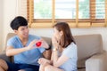 Beautiful portrait young asian couple gesture holding heart shape together, husband give heart shape wife cheerful smiling