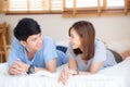 Beautiful portrait young asian couple relax and satisfied together in bedroom at home, family lying on bed Royalty Free Stock Photo