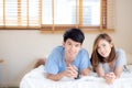 Beautiful portrait young asian couple relax and satisfied together in bedroom at home Royalty Free Stock Photo