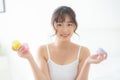 Beautiful portrait young asian woman attractive holding jars of cream and lotion skin for face fresh and soft at the room Royalty Free Stock Photo