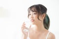 Beautiful portrait young asian woman caucasian smiling with nutrition thirsty and drinking glass of water mineral with fresh Royalty Free Stock Photo