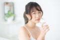 Beautiful portrait young asian woman caucasian smiling with nutrition thirsty and drinking glass of water mineral with fresh Royalty Free Stock Photo