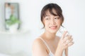 Beautiful portrait young asian woman caucasian smiling with nutrition thirsty and drinking glass of water Royalty Free Stock Photo
