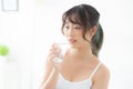 Beautiful portrait young asian woman caucasian smiling with nutrition thirsty and drinking glass of water Royalty Free Stock Photo