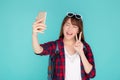 Beautiful portrait young asian woman cheerful smiling and take selfie on smart mobile phone Royalty Free Stock Photo