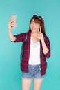 Beautiful portrait young asian woman cheerful smiling and take selfie on smart mobile phone Royalty Free Stock Photo