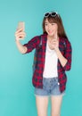 Beautiful portrait young asian woman cheerful smiling and take selfie on smart mobile phone Royalty Free Stock Photo