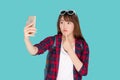Beautiful portrait young asian woman cheerful smiling and take selfie on smart mobile phone. Royalty Free Stock Photo