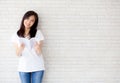 Beautiful of portrait young asian woman happiness relax standing reading book on concrete cement white background Royalty Free Stock Photo