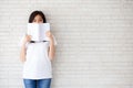 beautiful portrait young asian woman happy hiding behind open th Royalty Free Stock Photo