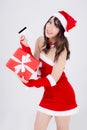 Beautiful portrait young asian woman happy holding credit card and red gift box in Christmas holiday isolated Royalty Free Stock Photo