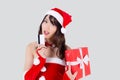 Beautiful portrait young asian woman happy holding credit card and red gift box in Christmas holiday isolated. Royalty Free Stock Photo