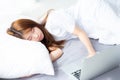 Beautiful of portrait young asian woman with laptop lying down in bedroom. Royalty Free Stock Photo