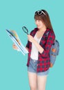 Beautiful portrait young asian woman looking map world with magnify glass for planning guide to travel summer trip. Royalty Free Stock Photo