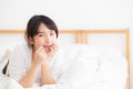 Beautiful portrait young asian woman lying and smile while wake up with sunrise at morning, girl with happy annd fun Royalty Free Stock Photo