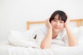 Beautiful portrait young asian woman lying and smile while wake up with sunrise at morning, girl with happy annd fun Royalty Free Stock Photo