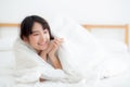 Beautiful portrait young asian woman lying and smile while wake up with sunrise at morning, girl with happy and fun Royalty Free Stock Photo