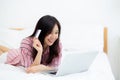Beautiful of portrait young asian woman lying users credit card with laptop Royalty Free Stock Photo