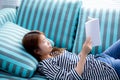 Beautiful of portrait young asian woman relax lying reading book Royalty Free Stock Photo