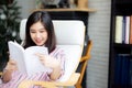 Beautiful of portrait young asian woman relax sitting reading bo Royalty Free Stock Photo