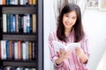 Beautiful of portrait young asian woman relax sitting reading book in living room at home Royalty Free Stock Photo